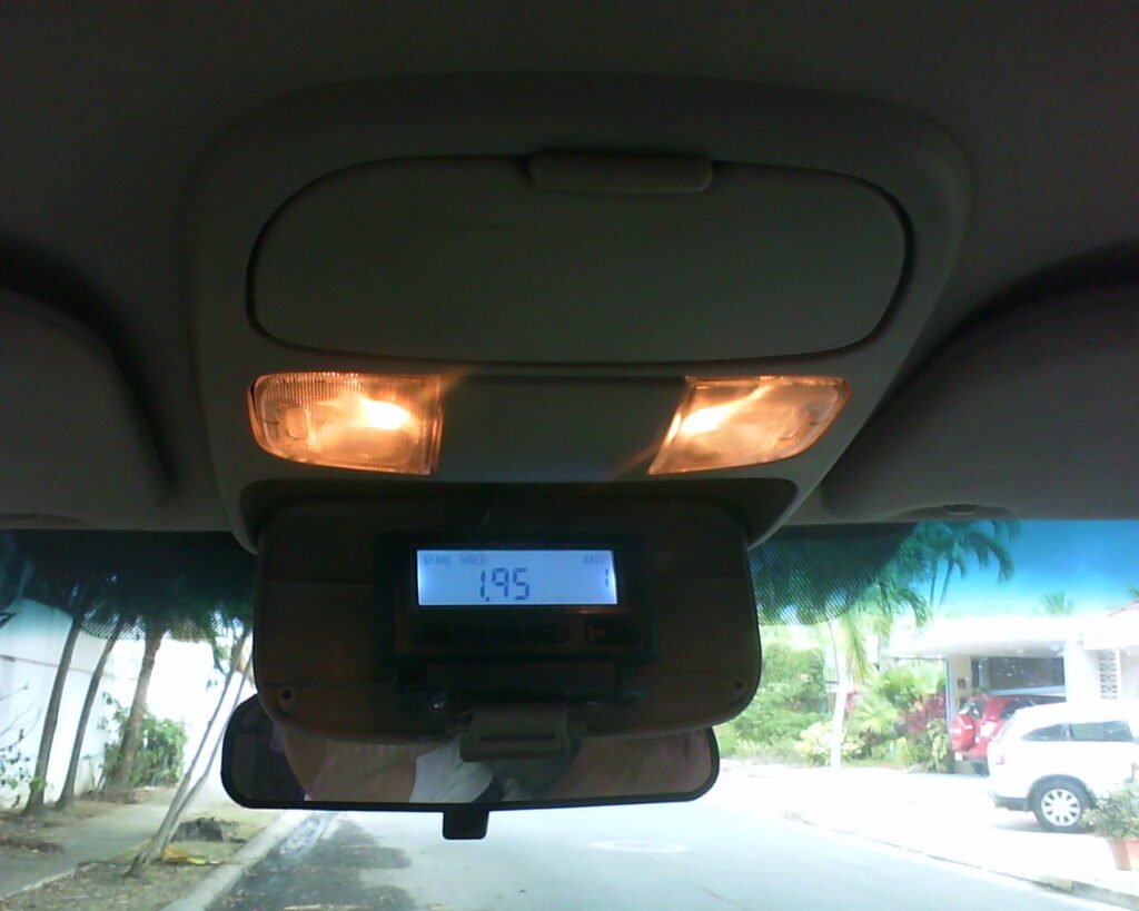 iElectron MT-10 taximeter mounted under a car's rearview mirror
